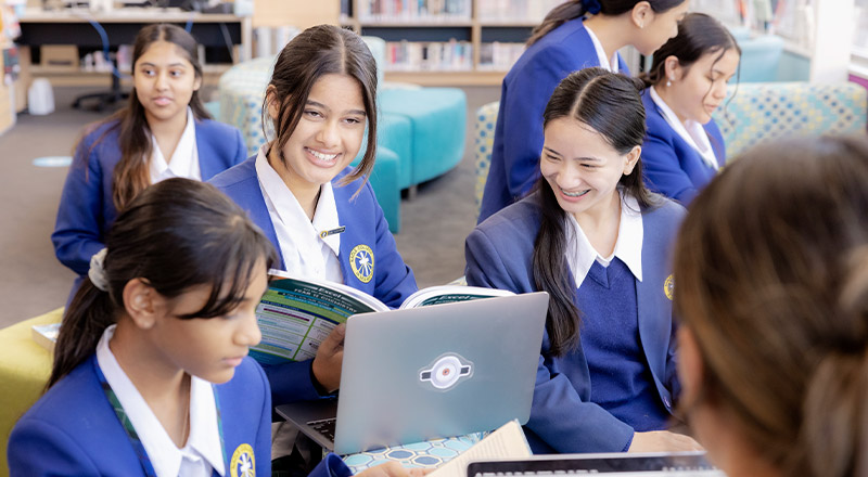 Nagle Catholic College South Blacktown students reading and using laptop