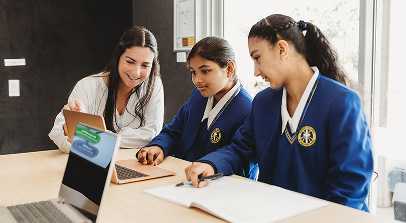 Teacher instructing students at Nagle Catholic College Blacktown