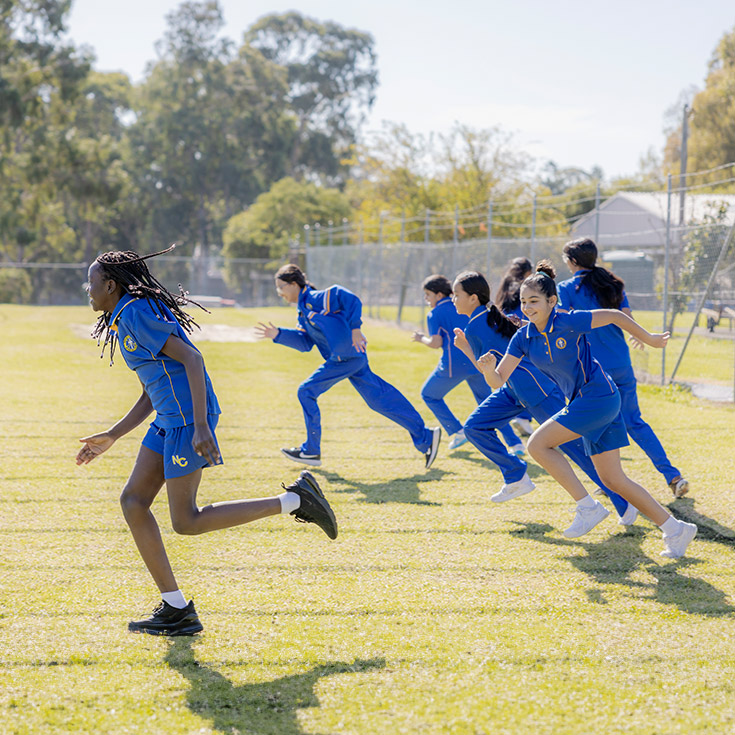 Nagle Catholic College South Blacktown students running on field