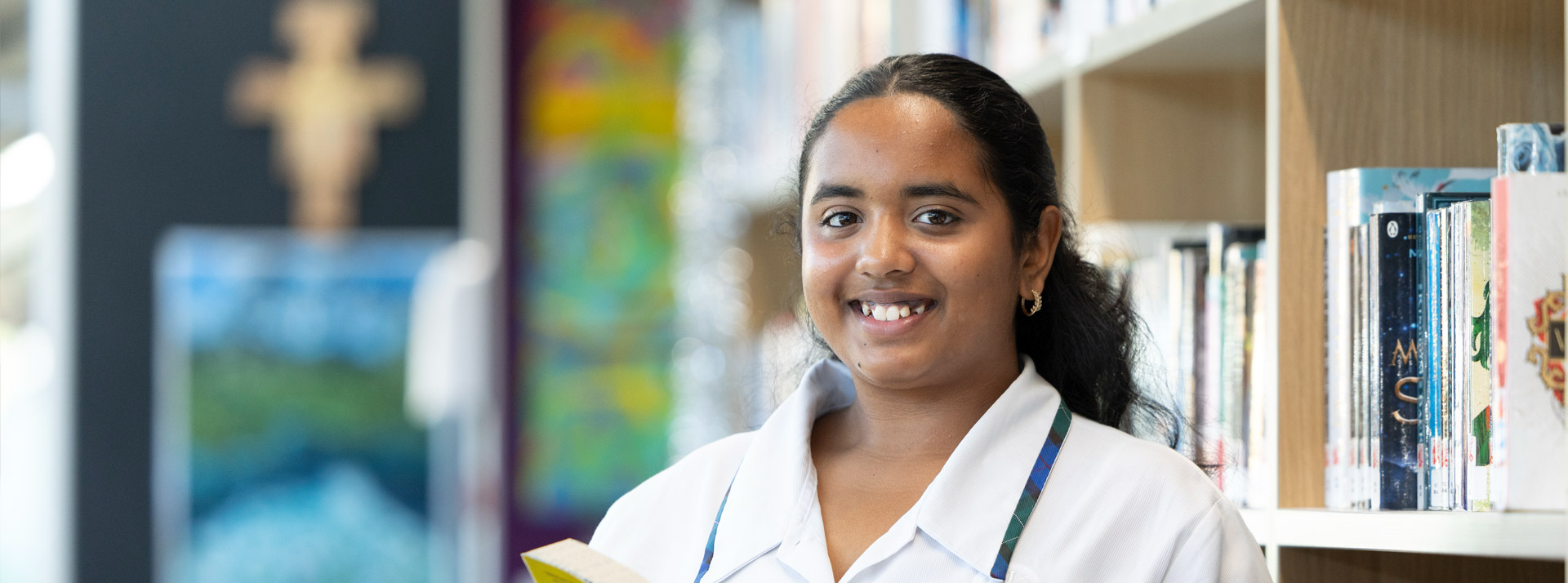 Nagle Catholic College student reading book in school library