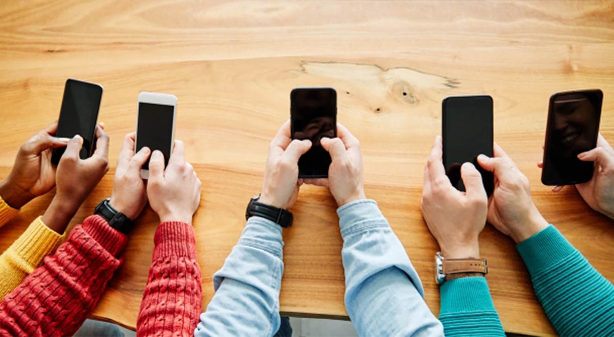 Generic image of students holding mobile devices